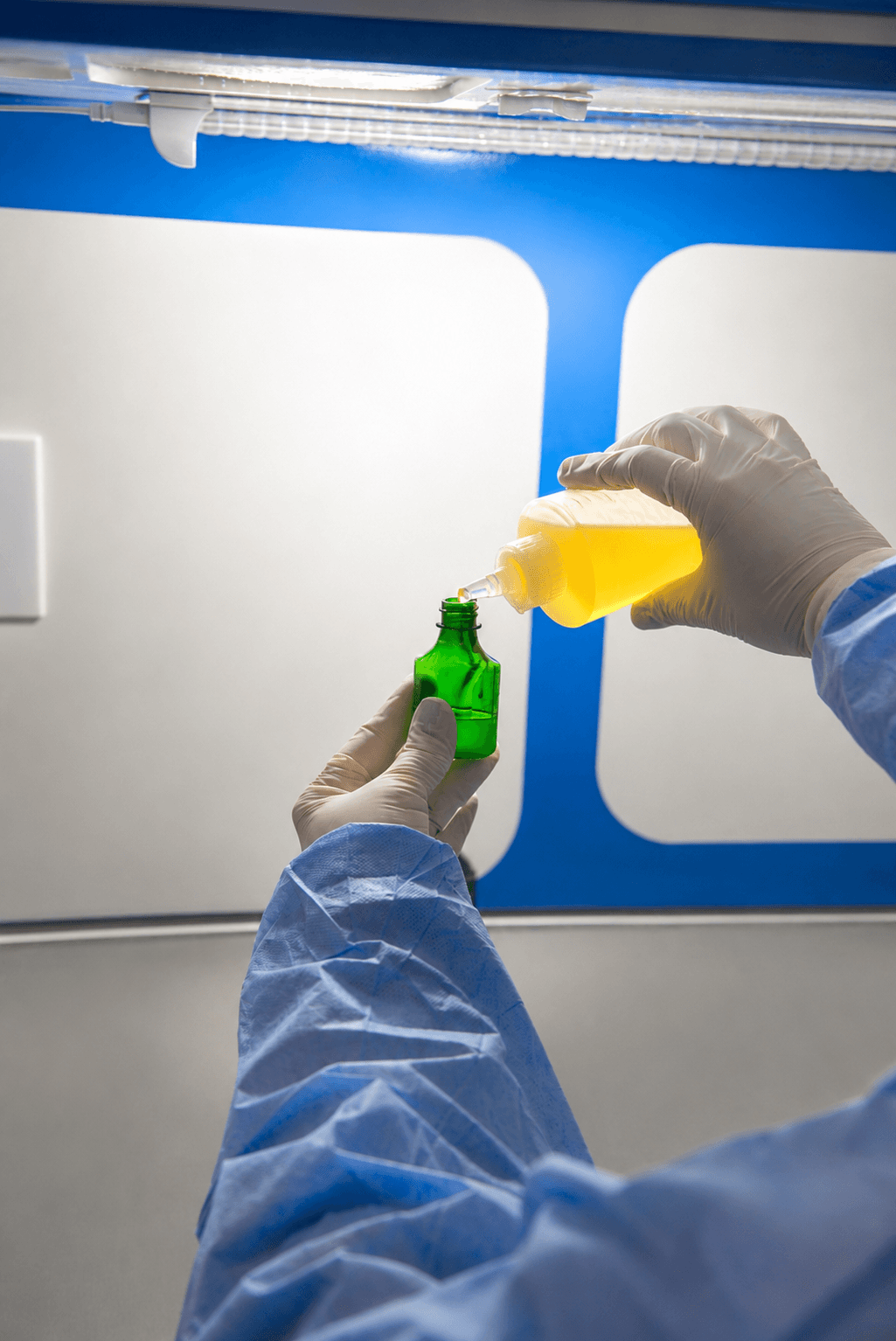 Pharmacist mixing a compounded preparation in the Village Pharmacy lab.