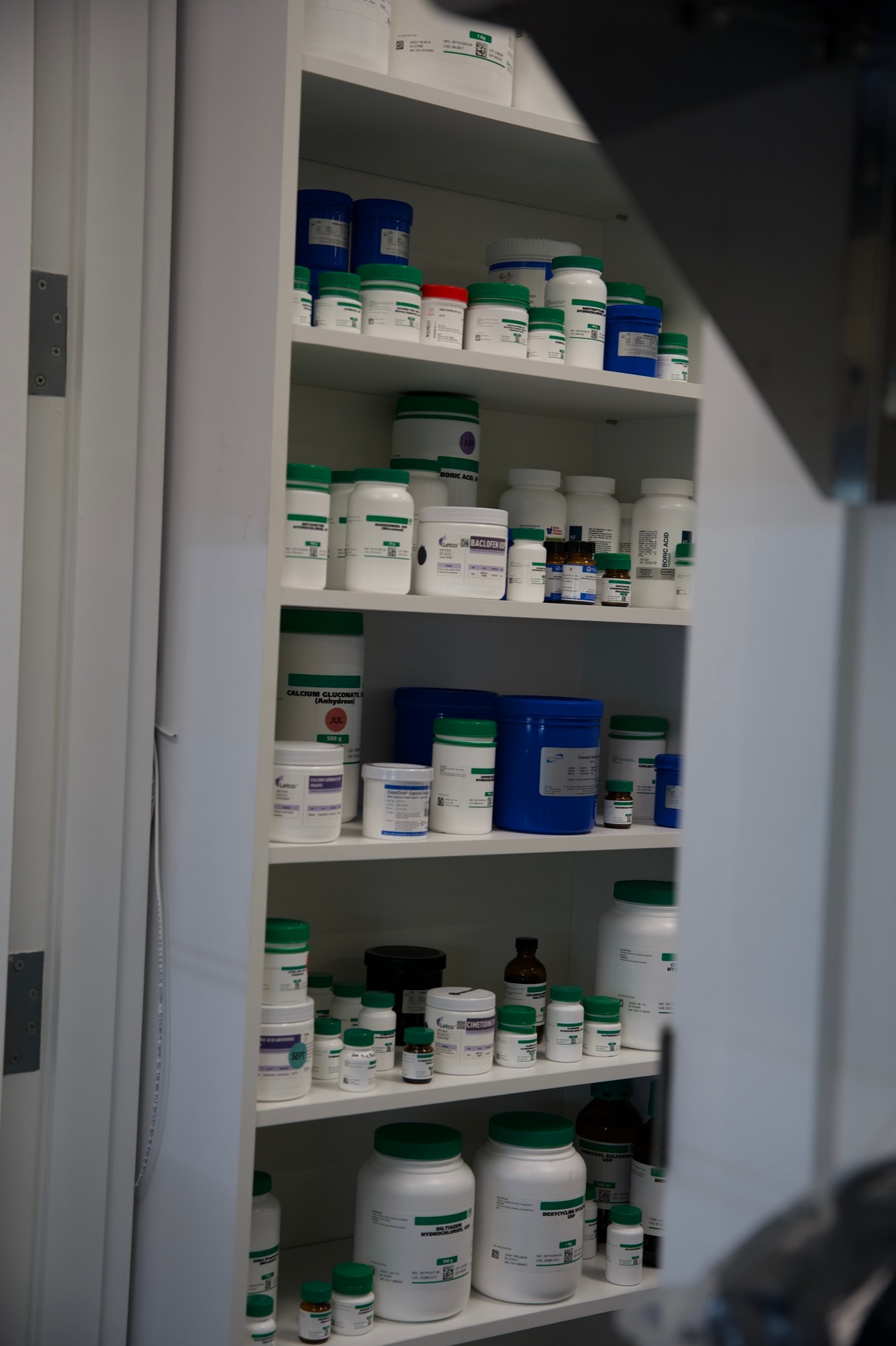 Compounding ingredients carefully shelved at Village Pharmacy & Compounding