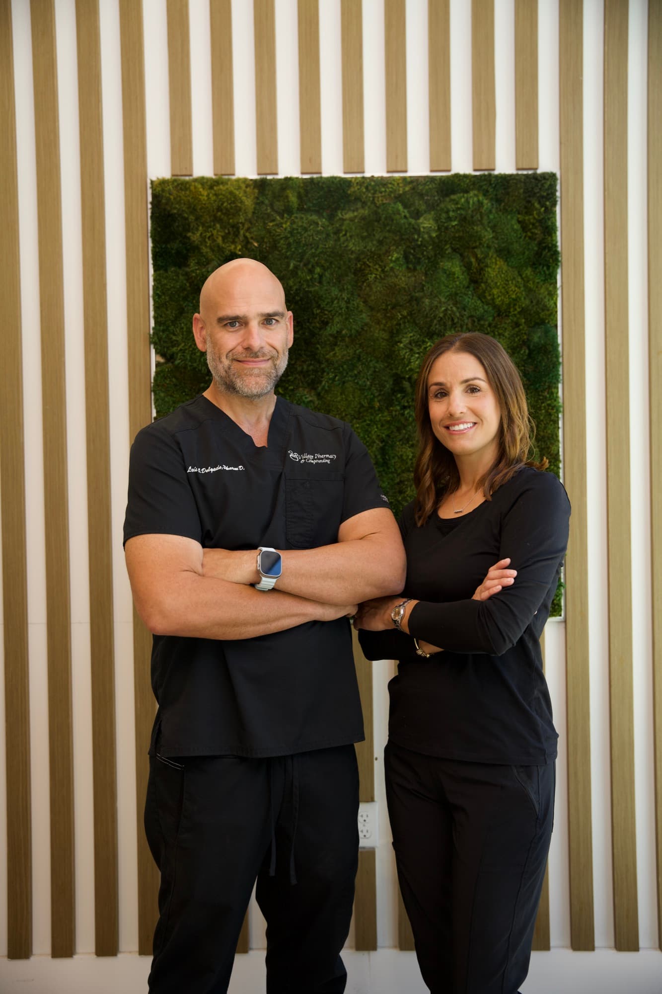 Luis O. Delgado, PharmD, and his wife, founders of Village Pharmacy & Compounding, inside their Miami pharmacy